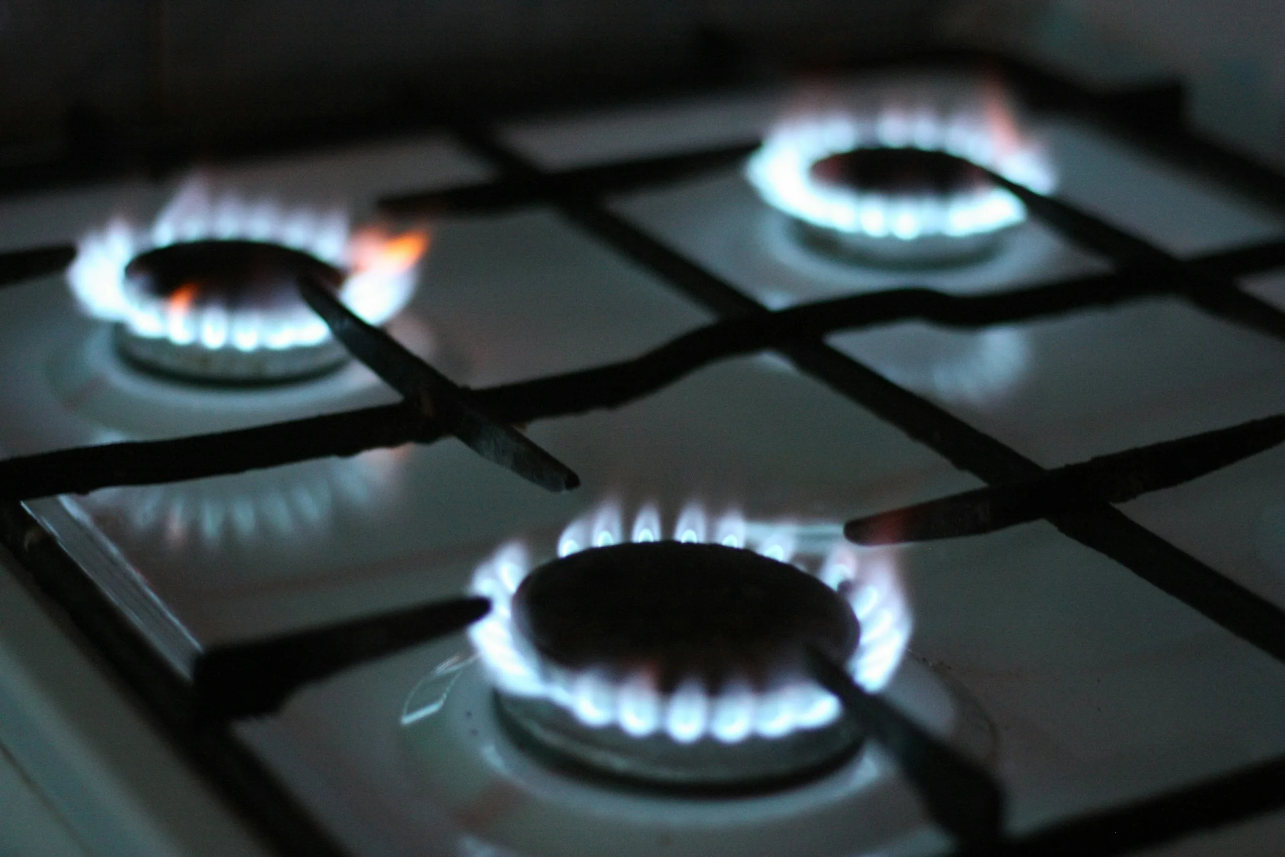 Blue flames on a gas cooking hob
